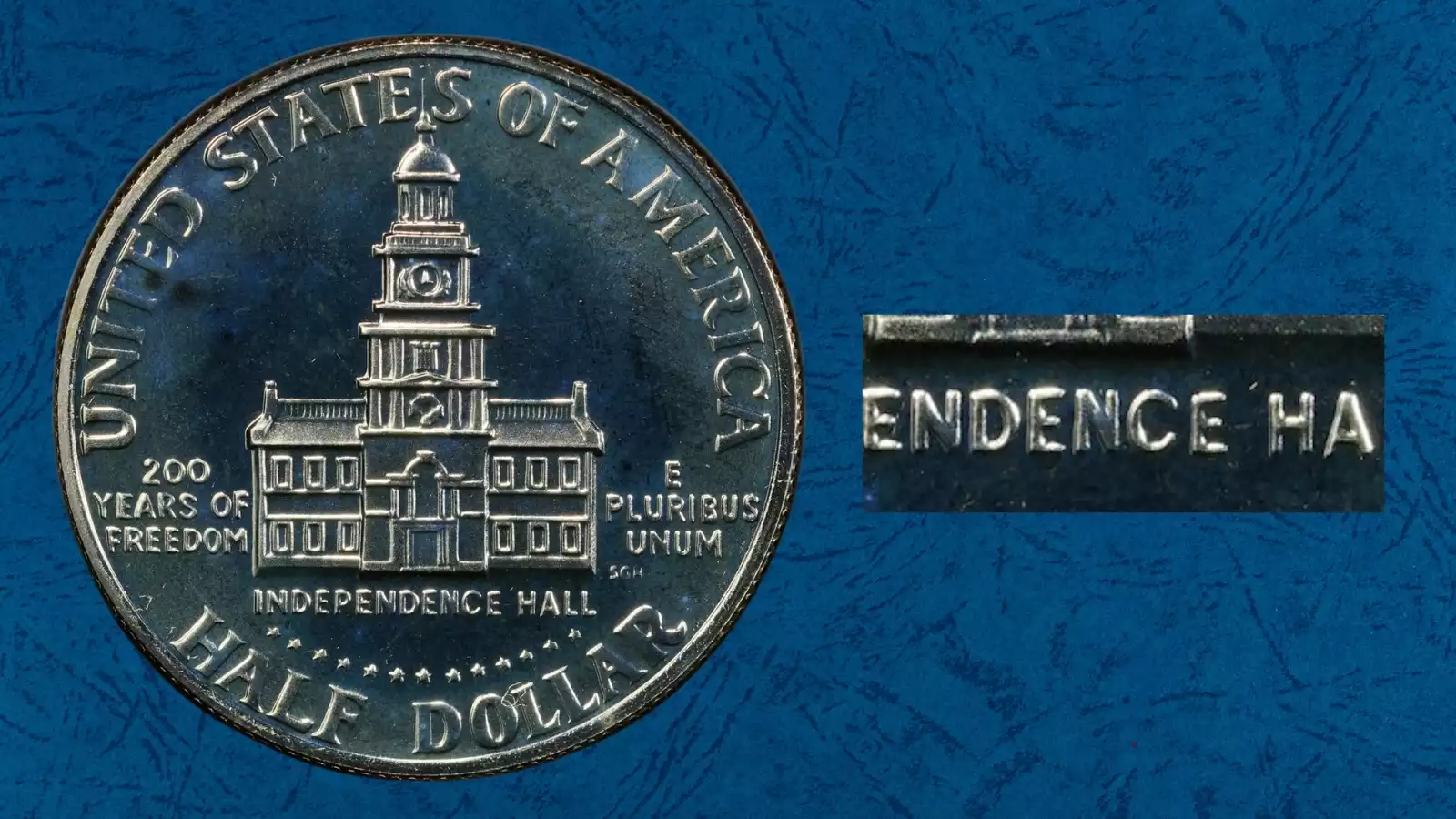 1976 Kennedy half dollar DDR FS-801 doubled die reverse showing doubling in E PLURIBUS UNUM motto